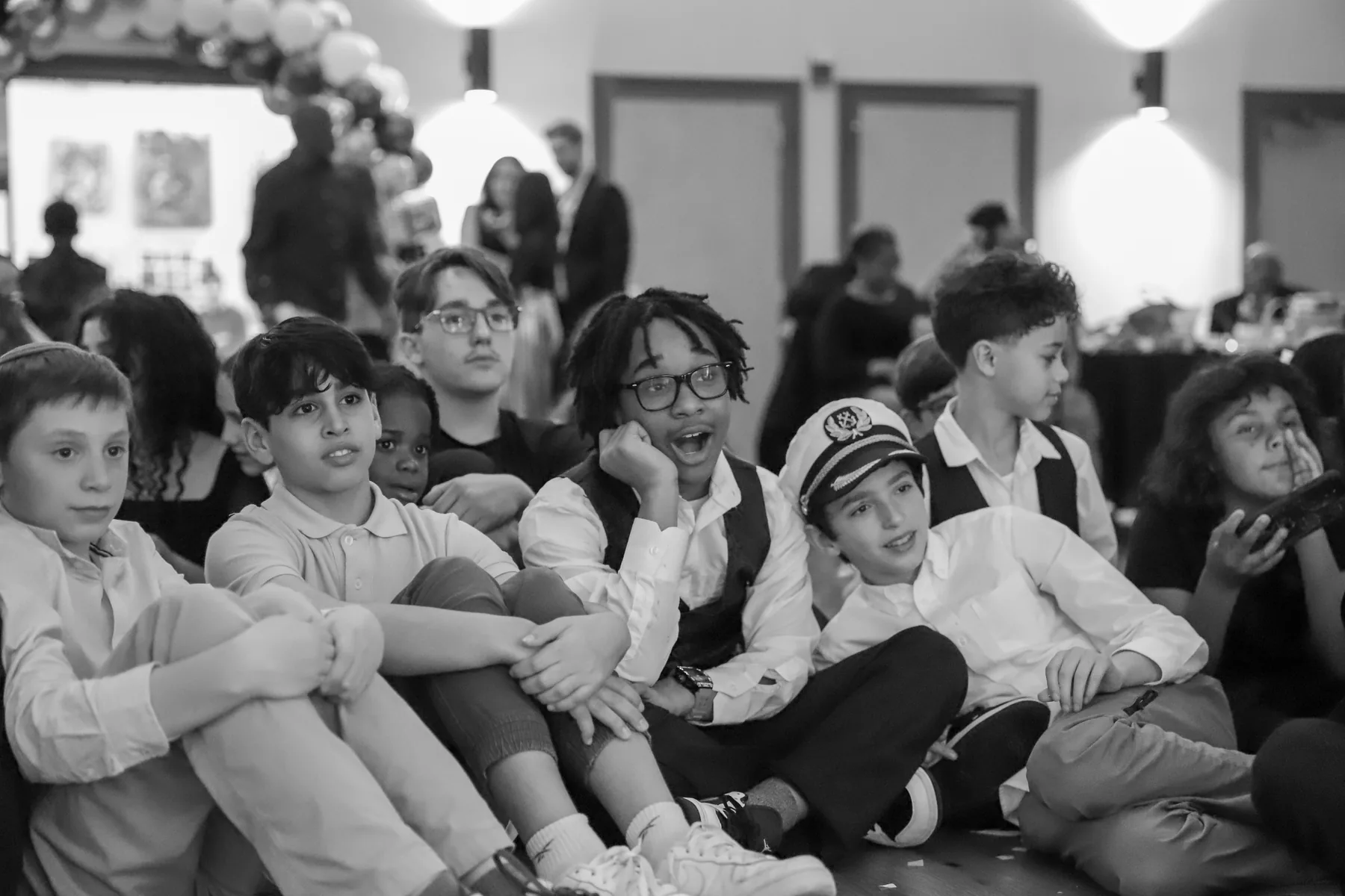 Family and friends sharing an emotional moment at a Bar Mitzvah